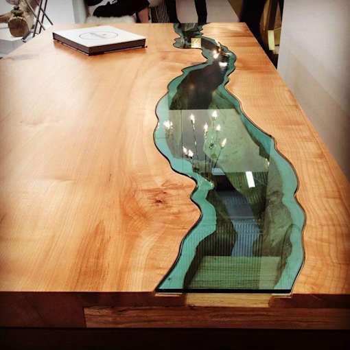 a wooden table with a glass top on top of it