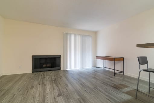 Living room with fireplace and balcony