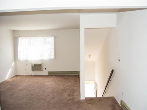 Carpeted Living Area at Brookwood at Oakdale 55+, Oakdale, NY