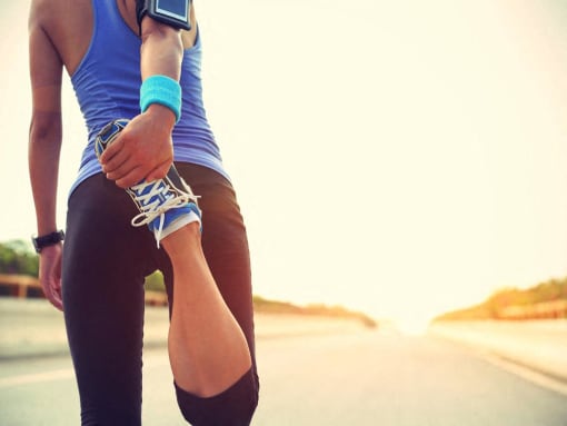 Person stretching before outdoor exercise at The Brook At Columbia Apartments, Columbia, MD 21044