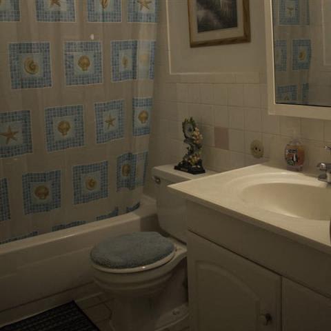 a bathroom with a toilet sink and bathtub