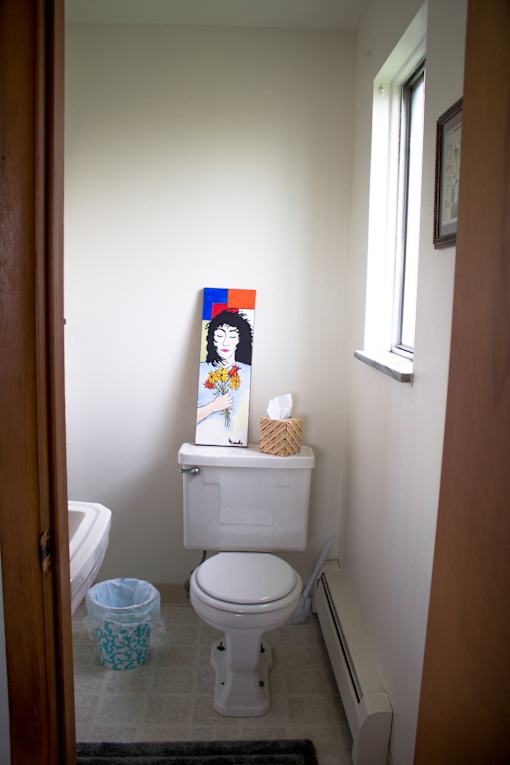 a bathroom with a toilet and a sink