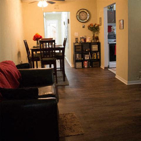 a dining room with a table and chairs
