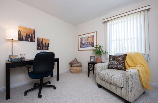 a home office with a chair and a desk