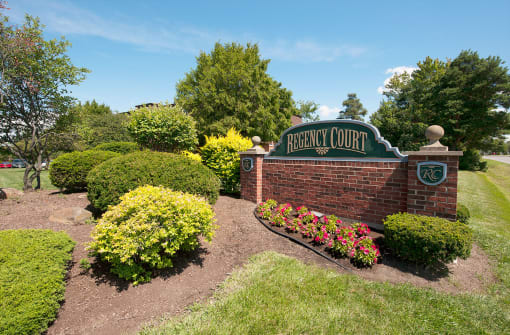 regency court entry sign with beautiful landscaping