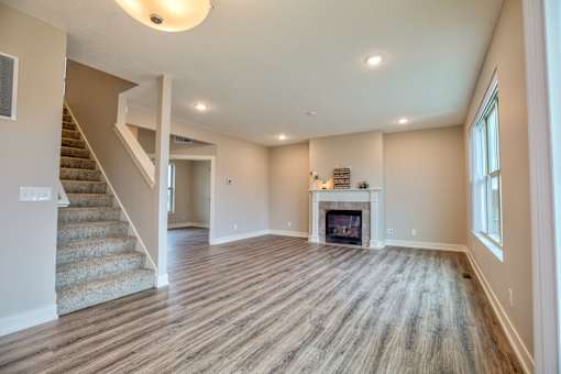 Kitchen and Living room of Home For Rent in Holt Michigan | Aspen Lakes Estates