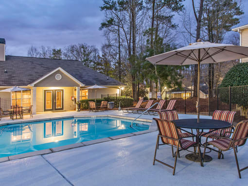 Enjoy Our Pool Deck with Patio and Chairs at Addison on Cobblestone, Fayetteville, 30215