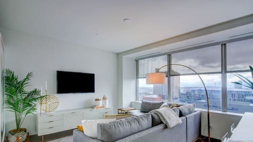 Tv and couch at The Grand, Kansas City