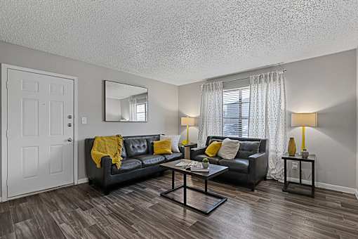 Living space with sectional sofa, coffee table, and décor