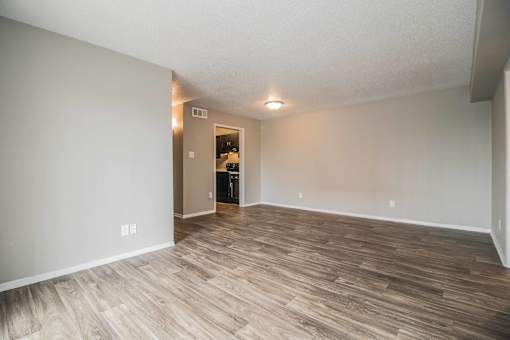 Open living and dining area with neutral tones and modern flooring