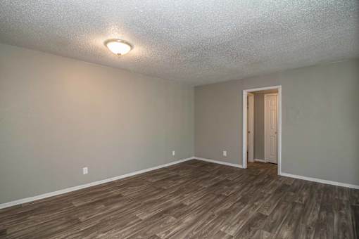 edroom with natural lighting and soft carpet at Verano Oaks Apartments in Hurst