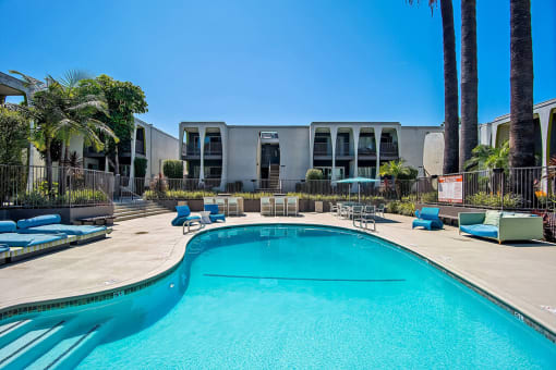 Swimming Pool And Relaxing Area at Parc at 5 Apartments, Downey, CA