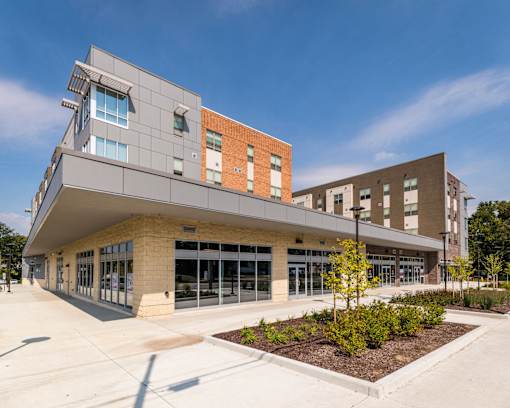 A modern building with a flat roof and large windows.