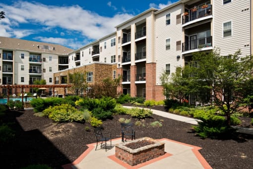 Outdoor courtyards with gas grills and fire pits at Alexander at Patroon Creek, Albany, New York