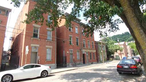 Exterior of brick apartment building from across the street