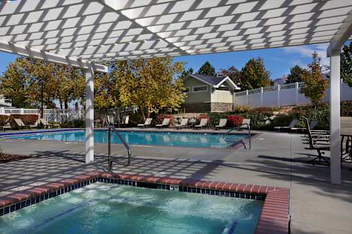 Swimming pool and spa with covered pergola area at Liberty Hill Apartments, Utah, 84020