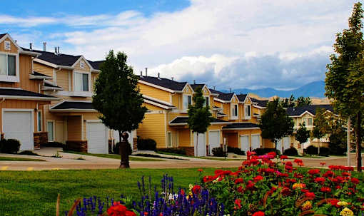 Townhome community with colorful flower gardens at Liberty Hill Apartments, Draper, UT