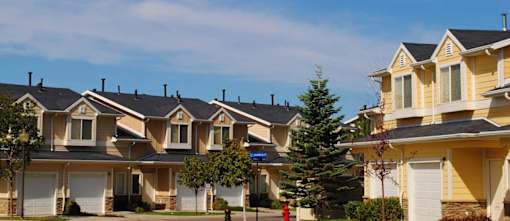 Townhome community with attached garages and landscaping at Liberty Hill Apartments, Draper, Utah