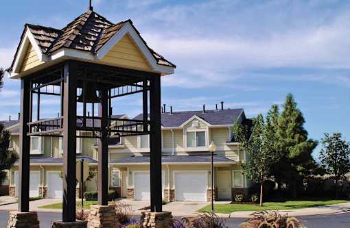 Bell tower gazebo with stone base and landscaping at Liberty Hill Apartments, Draper