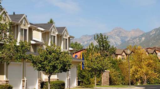 Two story townhomes with mountain backdrop at Liberty Hill Apartments, Utah