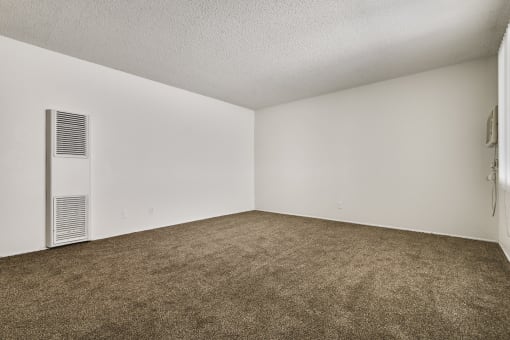 Living room with air conditioning, carpeted floors