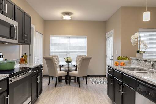 dining table surrounded by four chairs at Thirteen01 at Hartman Lakes, Illinois, 62269