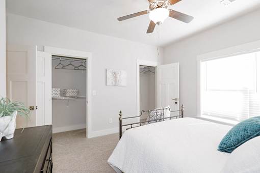Bedroom with open closet at McHenry Square Apartments, Augusta