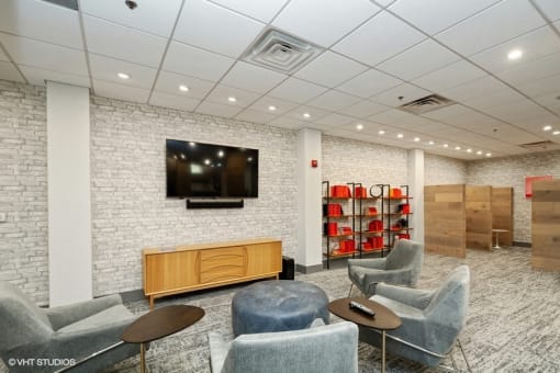 a room with chairs and a tv on the wall at 3333 Wisconsin, Washington, Washington