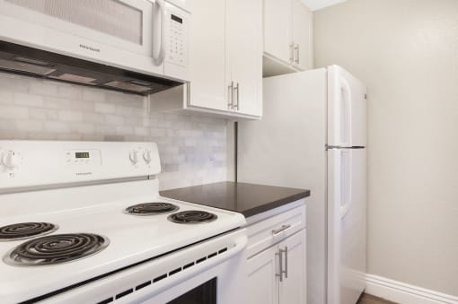 All Electric Kitchen In White at Pacific Trails Luxury Apartment Homes, California, 91722