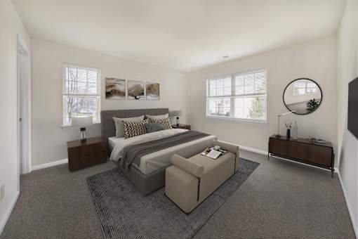 Bedroom with cozy bed and window at The Apartments at Owings Run, Owings Mills, 21117