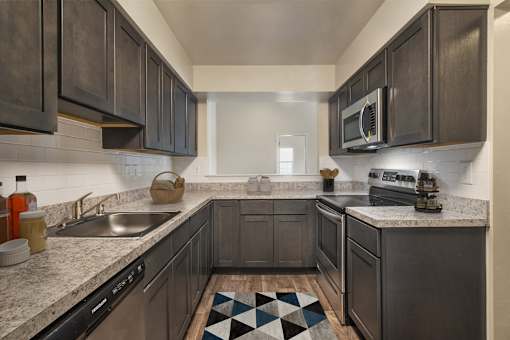 Kitchen with mosaic tiles at The Apartments at Owings Run, Maryland