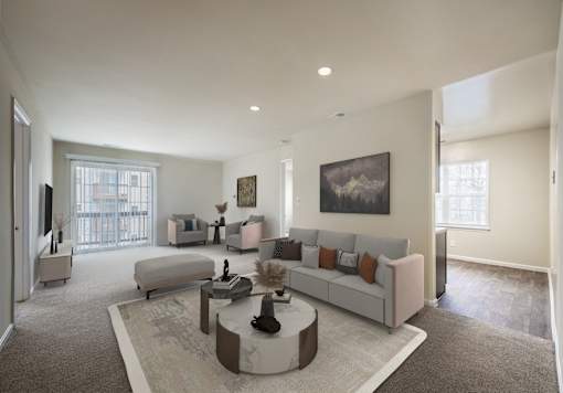 Living with couch and table and tv at The Apartments at Owings Run, Owings Mills