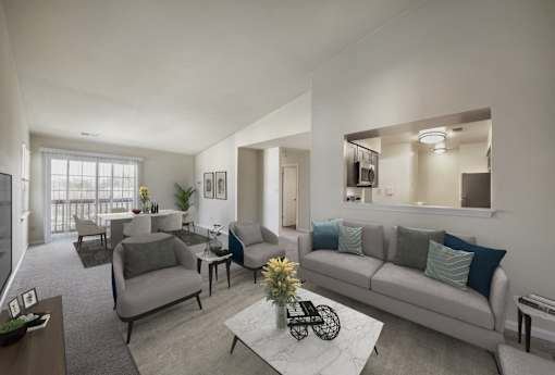 Living with couch and table and television at The Apartments at Owings Run, Maryland