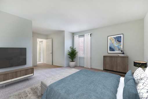 Bedroom With TV at The Apartments at Saddle Brooke, Cockeysville, MD