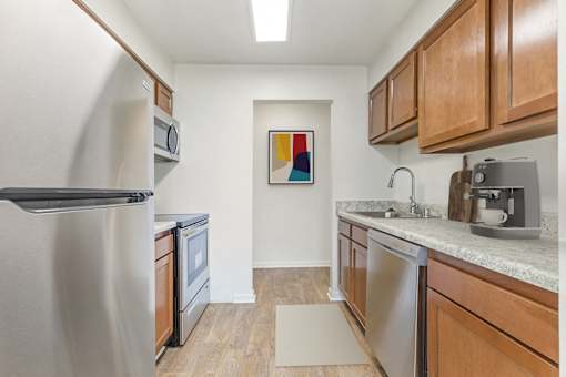 Fully Equipped Kitchen With Modern Appliances at The Apartments at Canterbury, Maryland, 21237