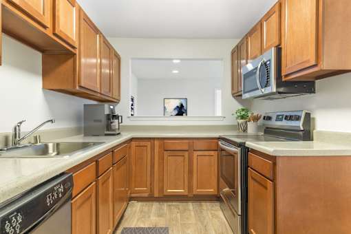 Fully Furnished Kitchen With Stainless Steel Appliances at The Apartments at Canterbury, Rosedale, MD, 21237