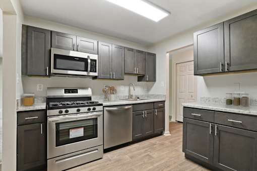 Kitchen With White Cabinetry And Appliances at Annapolis Roads, Annapolis, MD