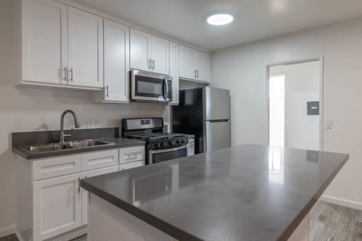 Kitchen with island and new counters and appliances