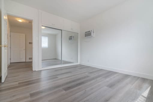 Bedroom with glass sliding door closets