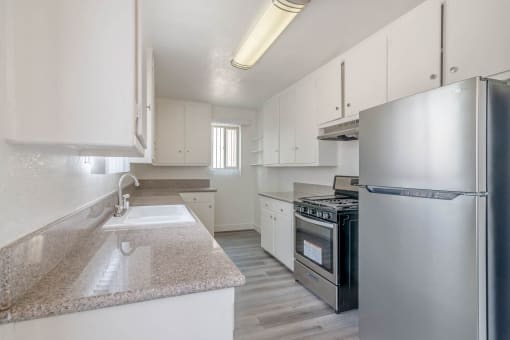 Kitchen with new floor countertops and appliances