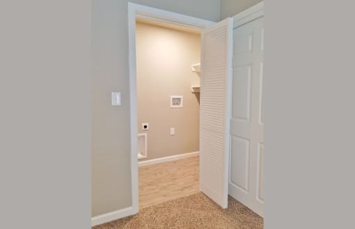 View into utility room with washer and dryer connections