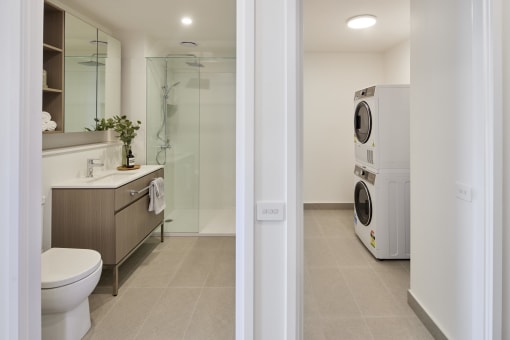 a bathroom with a washer and a dryer in it