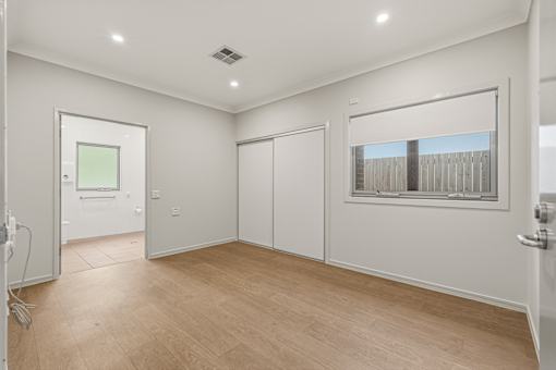 A room with a window and a door.