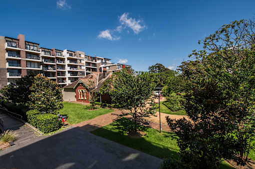 A residential area with apartment buildings and greenery.