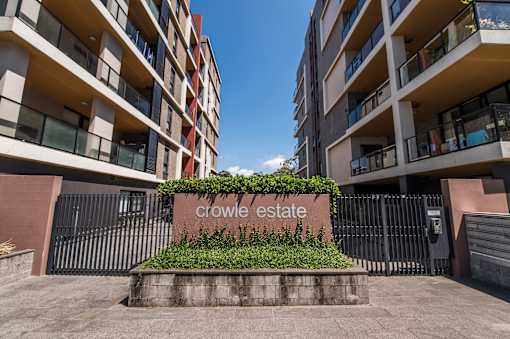 Crowle Estate sign in front of a building.