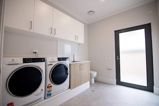 A laundry room with a washer and dryer.