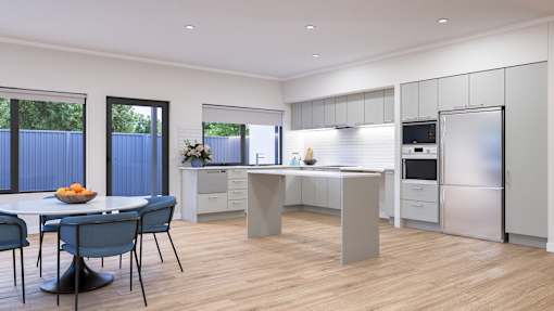 A modern kitchen with a dining table and chairs.