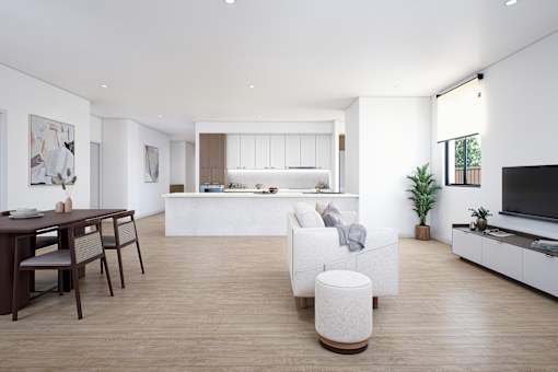 A modern living room with a dining table and a kitchen in the background.