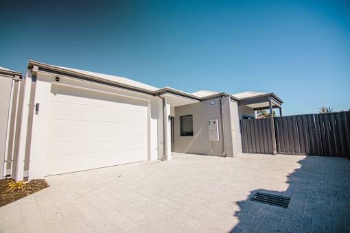 A white garage door is open.
