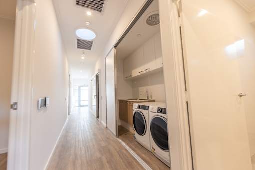 A laundry room with a washer and dryer in it.